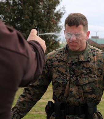 Lance Cpl. Dakota Jankowski gets sprayed with Oleoresin Capsicum, a potent pepper spray-like chemical during an obstacle course at Marine Corps Air Station Cherry Point, N.C, March 6, 2015. Marines with the Provost Marshal’s Office must complete the obstacle course while under the effects of OC spray in order to pass the exercise. Jankowski is a student in the block training course for PMO guards and a native of Camano Isle, Wash.